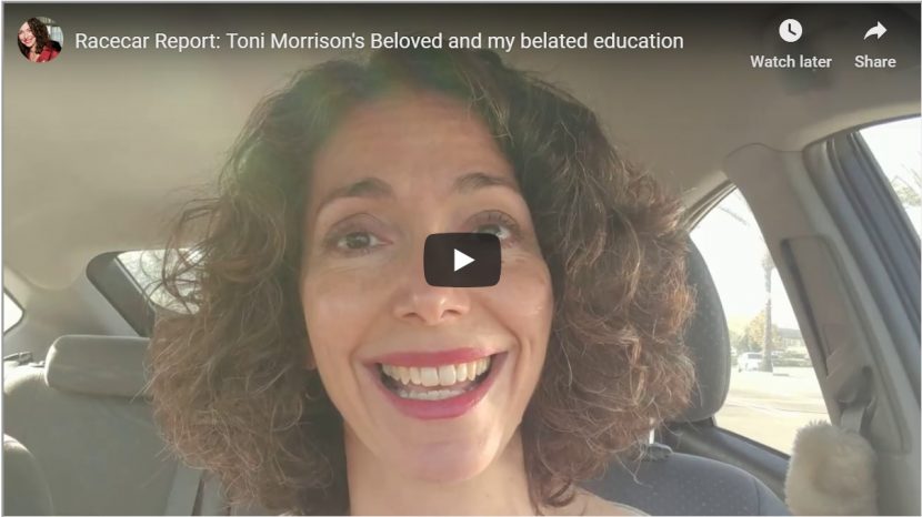 The author speaking to camera in her car