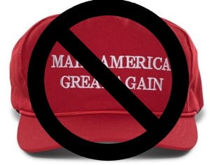 Image of a red Make America Great Again hat, with a superimposed big black circle with a bar through it, indicating NO or PROHIBITED