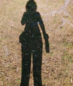 Photo of my shadow on a dry patch of grass in my local park