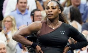 Serena Williams at the 2018 US Open with hands on hips getting "hysterical"